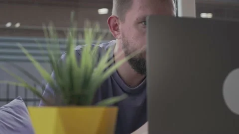 Man with beard works using laptop Stock Footage 153133162