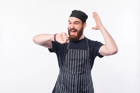 Man Bearded Chef looking afraid at smartwatch over white background 스톡 사진