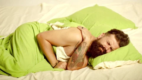 Man bearded hipster having problems with sleep. Sleep. Man sleep on bed with Stock Footage 116823561