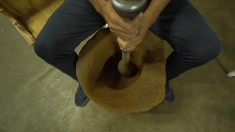 A man beating Turkish coffee with a mallet Stock Footage 144586519