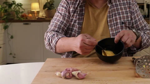 Man beats eggs with a spoon to make a pie dough, top view Stock Footage 289429982