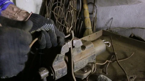 The man beats the hammer on the anvil. Left-side view. The person aligns the met Stock Footage 83055895