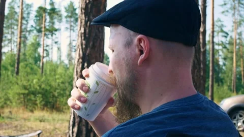A man with a beautifully styled beard, in a summer headdress and blue summer Stock Footage 158856034