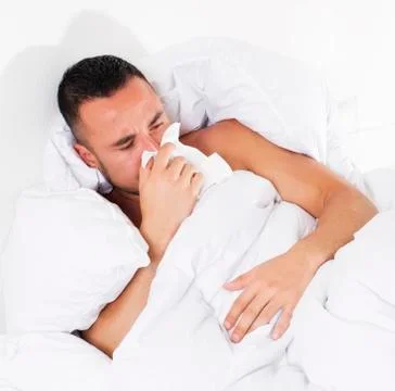 Man in bed with a cold Stock Photos