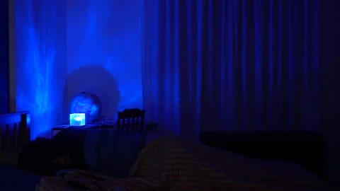 Man in bed has trouble falling asleep, insomnia and sleep problems lead to daily Stock Footage 326626300