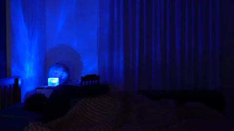 Man in bed has trouble falling asleep, insomnia and sleep problems lead to daily Stock Footage 326626302