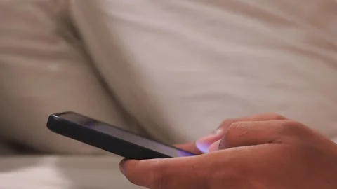 Man in bed at night using a mobile phone. Video stock 337208522