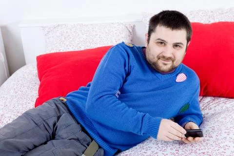 Man in bed Stock Photos