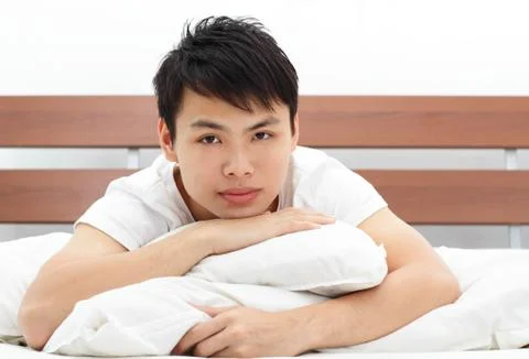 Man in bed Stock Photos