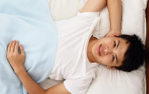 Man in bed Stock Photos