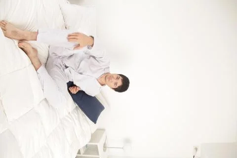 Man on the bed 写真素材