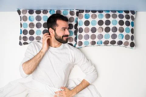 Man in bed in top view thinking an idea Stock Photos