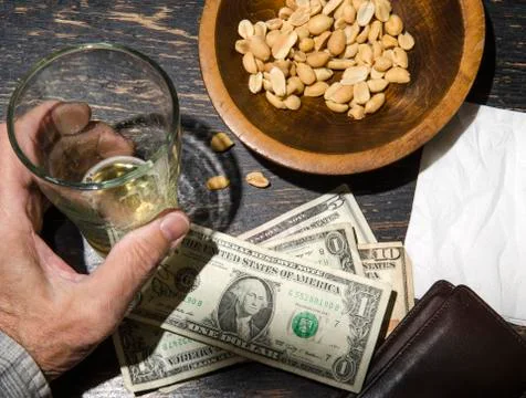 Man with beer at bar Stock Photos