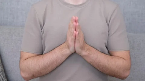 Man begging hand on sofa Stock Footage 265387347