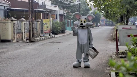 A man begging for money on the street using bunny costume on sunny day Video stock 172408557