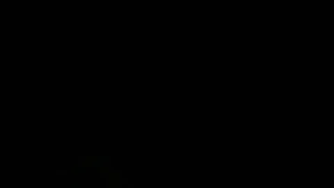 Man beginning to smoke a cigarette and getting a light with a match 動画素材 70749786