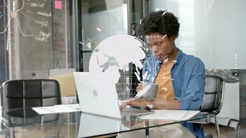 Man beginning typing checking papers lifting mug analyzing tech data globe Stock Footage 334883733