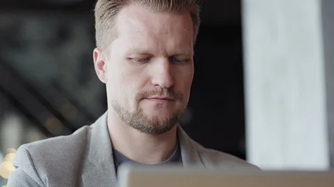 Man beginning work on laptop computer Video stock 111758371