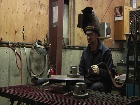 Man Begins Welding in Foundry Stock Footage 1089824