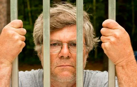 Man behind bars 库存照片