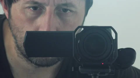 Man behind camera directing and recording scene Stock Footage 65596671