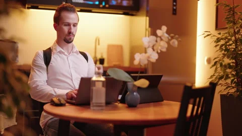 Man behind laptop computer wearing posture correction belt preventing pain 4K Stock Footage 170621567