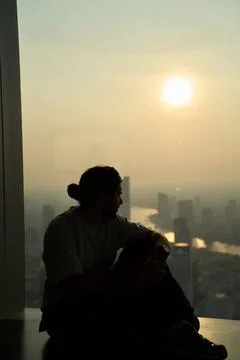 Man from behind looking at King Power Mahanakhon, Bangkok, 31 Thailand, 2025 Фото