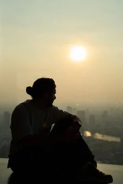 Man from behind looking at King Power Mahanakhon, Bangkok, 31 Thailand, 2025 Stock Photos