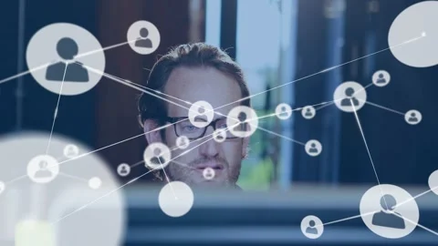 Man behind PC watching user icon appearing expanding network overlay adjusting Stock Footage 329909452