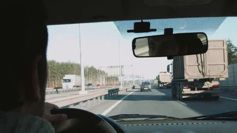 Man behind the wheel of a car Stock Footage 69180644