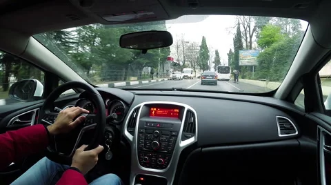The man behind the wheel driving around the city Vidéo 45499306