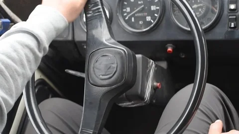 The man behind the wheel of an old bus in the light of day riding on the road Video stock 108849793