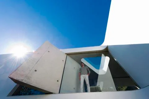 Man behind window Stock Photos