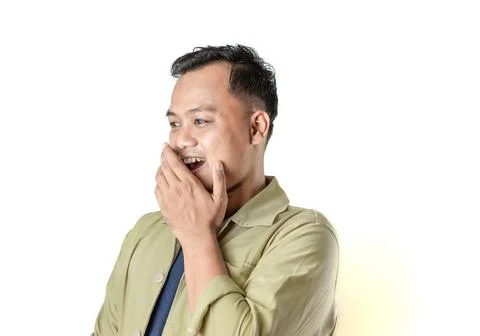 Man in beige jacket with surprised expression covering mouth on white Stock Photos