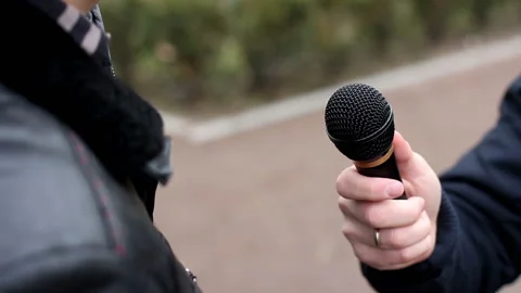 The man being interviewed on the street Stock-Footage 119114818