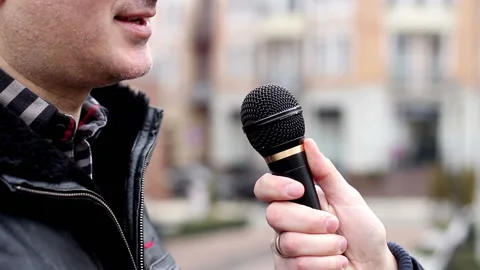 The man being interviewed on the street Stock Footage 119115090