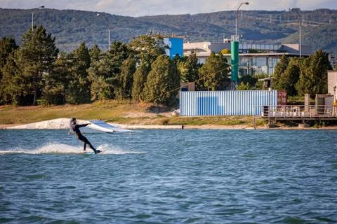 Man being pulled on a wakeboard on a lake Foto stock