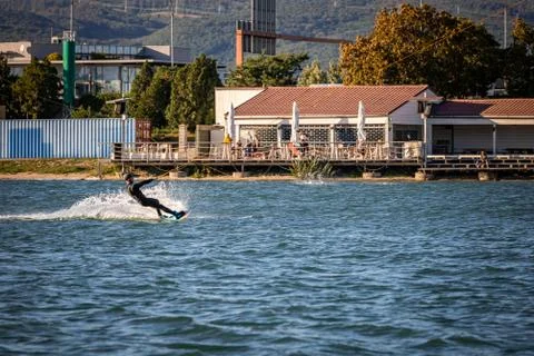Man being pulled on a wakeboard on a lake Foto stock