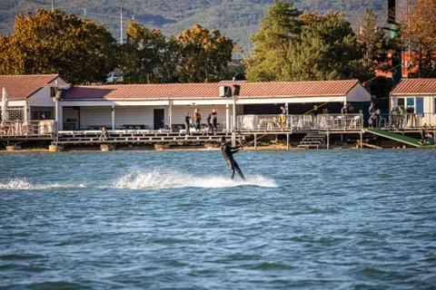 Man being pulled on a wakeboard on a lake Stock Photos