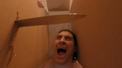 A man is being scared with a big knife. A dangerous quest. Video stock 317177144