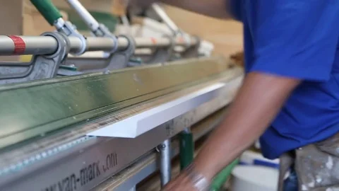 Man bending metal sheet for window casement in back of truck Stock Footage 77277784