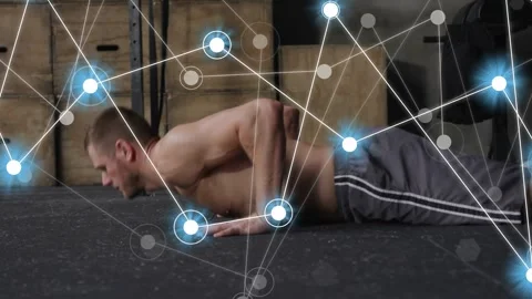 Man bending, reaching rubber floor, doing pushups while node-line overlay Stock Footage 333838091