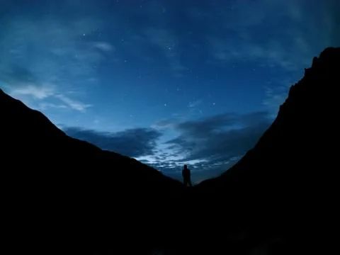 Man between the mountains Stock Photos