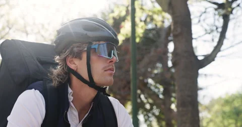 Man, bicycle and delivery with backpack in nature for travel, package or parcel Vidéo 318248633
