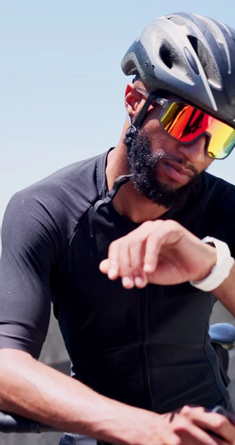 Man, bicycle and smart watch in city for training with timer, results or heart Stock Footage 327888627