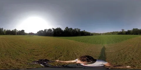 Man on bicycle exploring a green forest Stock Footage 116835988