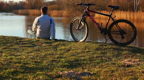 Man with a bicycle Stock Footage 65760981