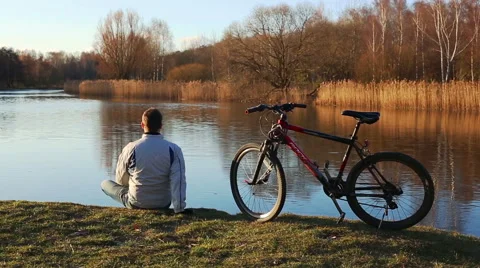 Man with a bicycle Stock Footage 65832261