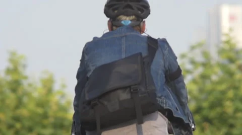 Man with bicycle in the park Stock Footage 53753378