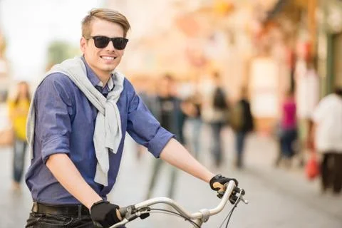 Man with bicycle Stock Photos